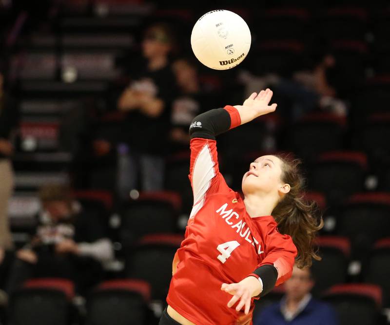 Mother McAuley's Sam Falk serves the ball against St. Charles East in the Class 4A semifinal game on Friday, Nov. 11, 2022 at Redbird Arena in Normal.