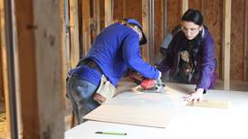 Women volunteers come together to build homes in McHenry for those in need