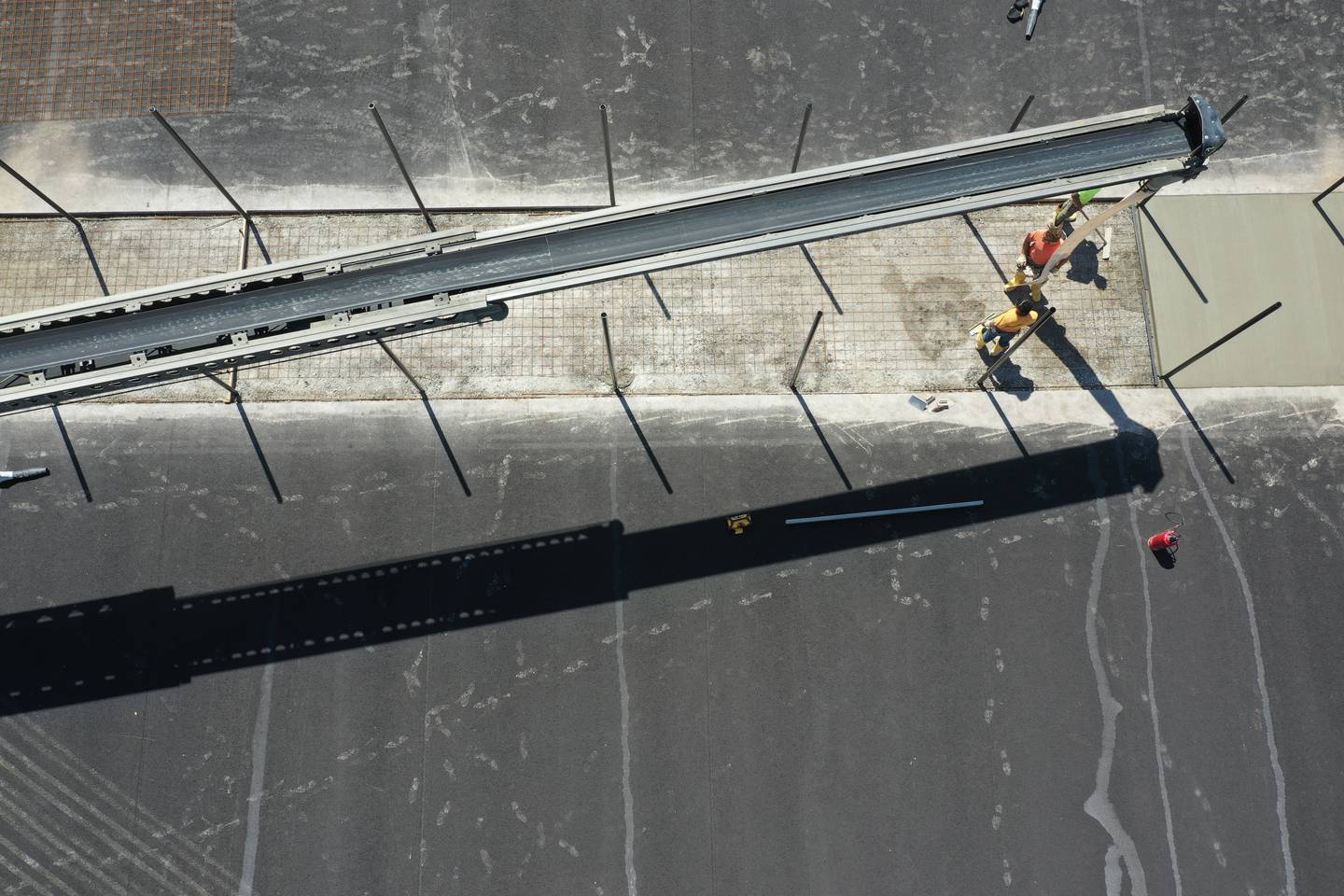 A crew pours concrete on a new tennis court at the La Salle-Peru Township High School Athletic Complex on Thursday, Aug. 17, 2023. In March of this year, L-P announced a $9.5 million addition/renovation to its sports complex. The project will include the addition of a baseball field, two softball fields and four tennis courts; the installation of artificial turf on the soccer field; the expansion of parking; the addition of restrooms in the soccer building; and construction near the baseball/softball fields that will include a concession stand, press box and restrooms.