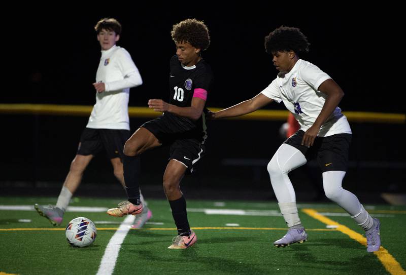 Manteno's Justin Foster, left, controls the ball as Chicago Christian's Caleb Daniels, right, challenges during a sectional game on Tuesday, October 28. 2025.