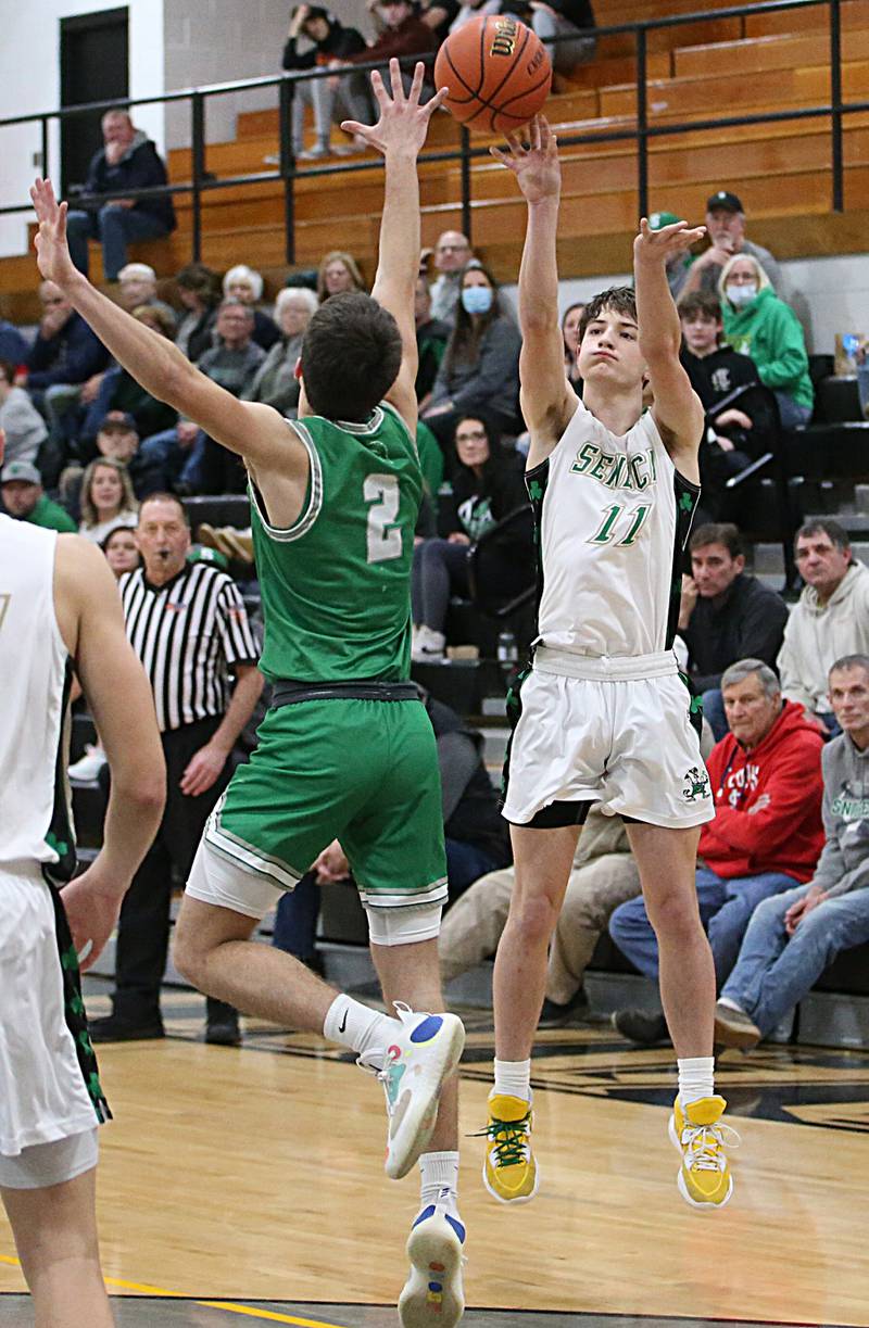 Seneca's John Farcus shoots a shot from behind the arc over Dwight's Dawson Carr during the Tri-County Conference Tournament on Wednesday, Jan. 25, 2023 at Putnam County High School.