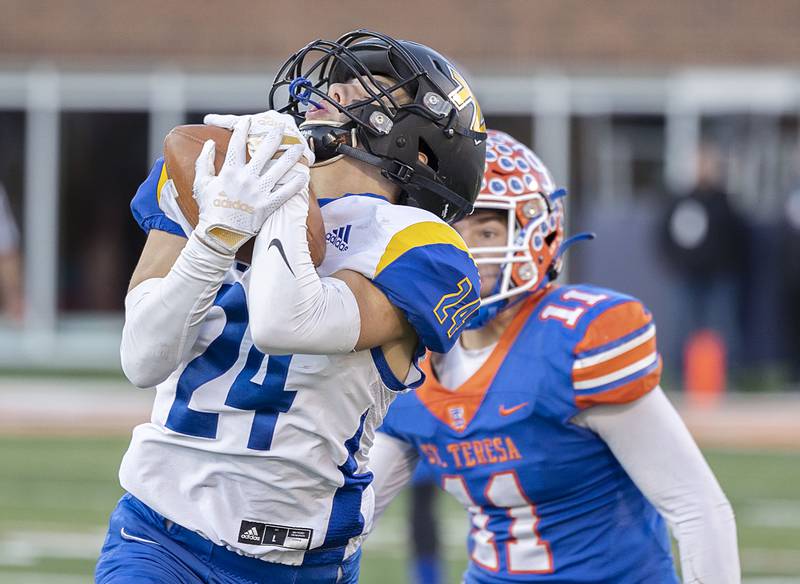 Tri-Valley’s Colton Prosser hauls in pass to put the Vikings deep in the Bulldogs territory late in the game against St. Teresa Decatur in the class 2A IHSA football state championship game Friday, Nov. 25, 2022.