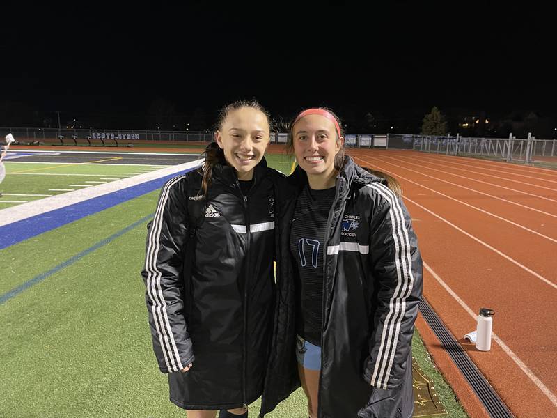 St. Charles North junior Laney Stark (left) and senior Bella Najera following the North Stars' 4-0 victory over Crystal Lake Central on Tuesday. Photo by Jake Bartelson.