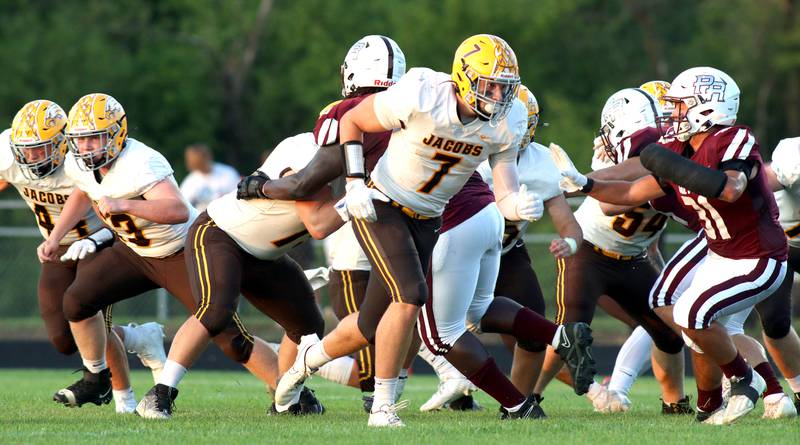Jacobs’ Grant Stec, 7, and the Golden Eagles play Prairie Ridge in varsity football at Crystal Lake Friday night.