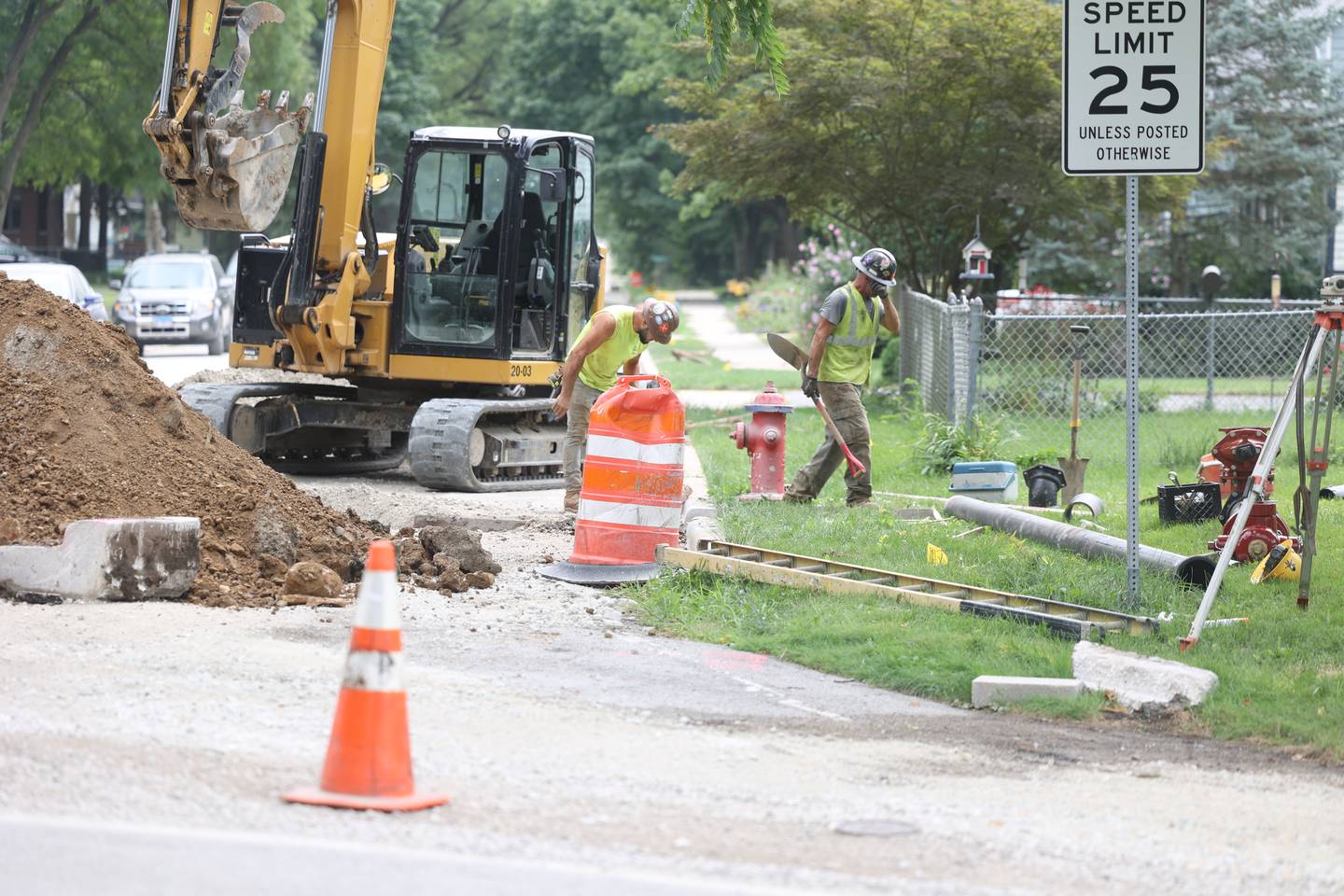 Construction worker work along Oakview Avenue placing new water pipes in Joliet. Thursday, August 4, 2022 in Joliet.