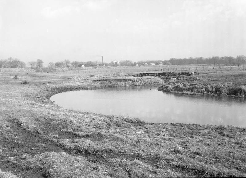 The Kishwaukee River looking northeast toward the railroad tracks and Northern Illinois State Teachers College (now NIU) in DeKalb in 1942.
