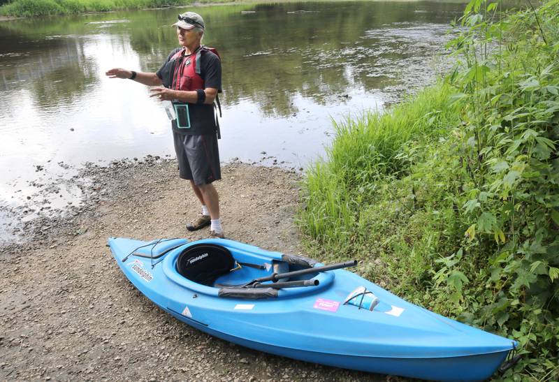 Greg Romaneck talks prior to putting his kayak in Thursday, Aug. 10, 2023, about taking care of our natural environment along the banks of the Kishwaukee River at the Knute Olson, Jr. Forest Preserve in Kingston. Romaneck has been making regular visits to pick up trash as he paddles the river and been an advocate for keeping the river and its surroundings free of pollution.