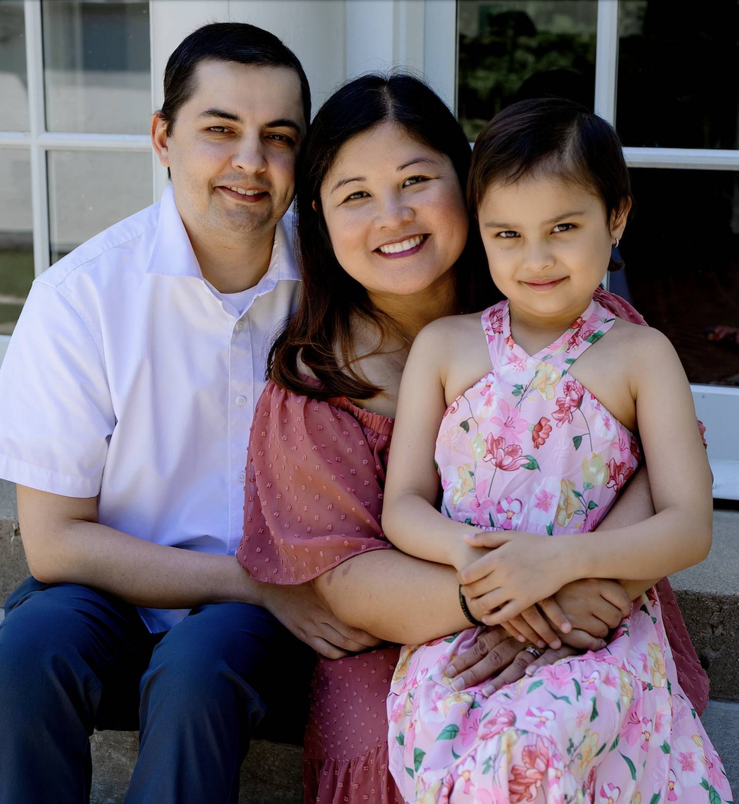 An undated family photo of Lilley Sloniker (far right) and her parents, Michael and Chriselle.