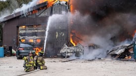 Crews battle Kane County barn fire with heavy smoke and roof collapse