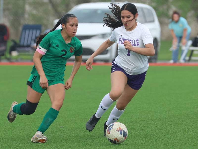 L-P's Vicky Tejada and Rochelle's Evelyn Garcia run after the ball on Wednesday, April 15, 2026 at the L-P Athletic Complex in La Salle.