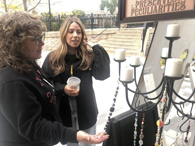 Lori Fisher, left, and Shelby Fairweather, right, have stores next door to each other at the McHenry Riverwalk Shoppes. They are hosting a Samhain observance at their stores on Friday, Nov. 1, 2024.