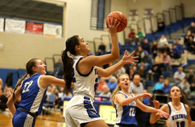 Geneva’s Leah Palmer gets the ball to the basket during a game against Wheaton North at Geneva on Friday, Dec. 22, 2023.