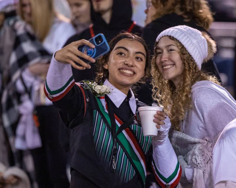 (from left) Clarissa Casas and Radia Thompson take selfie in student section on Friday, October 24, 2025 at Howard Fellows Stadium in LaSalle.