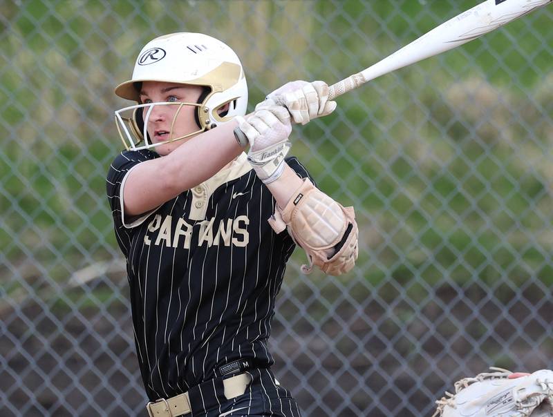Sycamore's Ema Durst watches the ball as she singles into left field Tuesday, April 22, 2025, during their game against Kaneland at Sycamore High School.