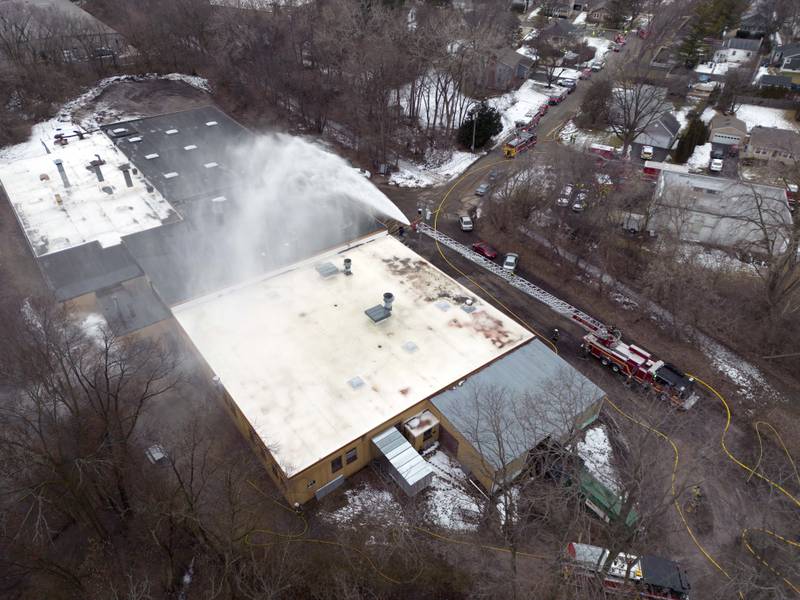 Area crews work to control a fire and hazmat response in the 400 block of Union Street Tuesday February 7, 2023 in Geneva.