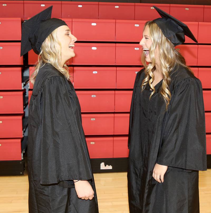 Bella Ring and Breanna Roberts chat before the Kaneland High School Class of 2023 Graduation Ceremony on Sunday, May 21, 2023 in DeKalb.