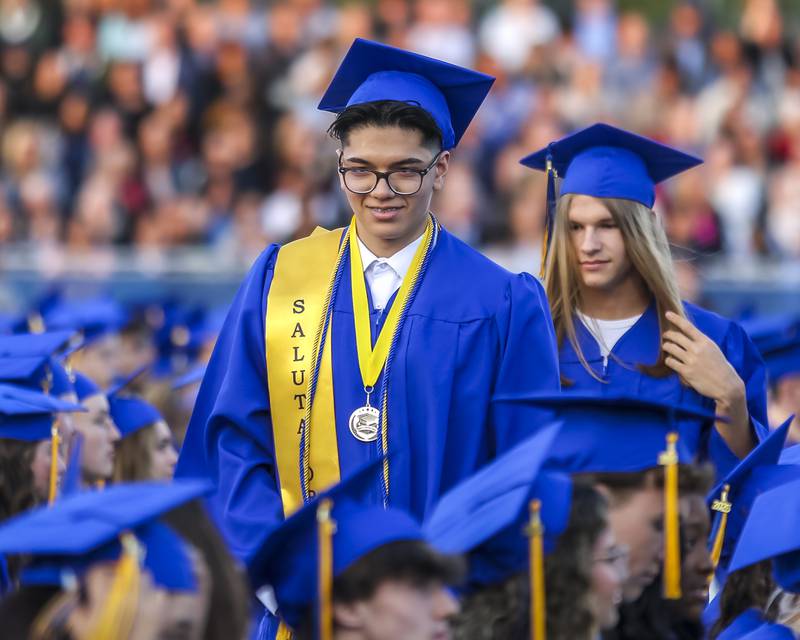 Students head to the stage to receive his diploma at the Lyons Township High School Graduation ceremony Wednesday, May 28, 2025  in Western Springs.