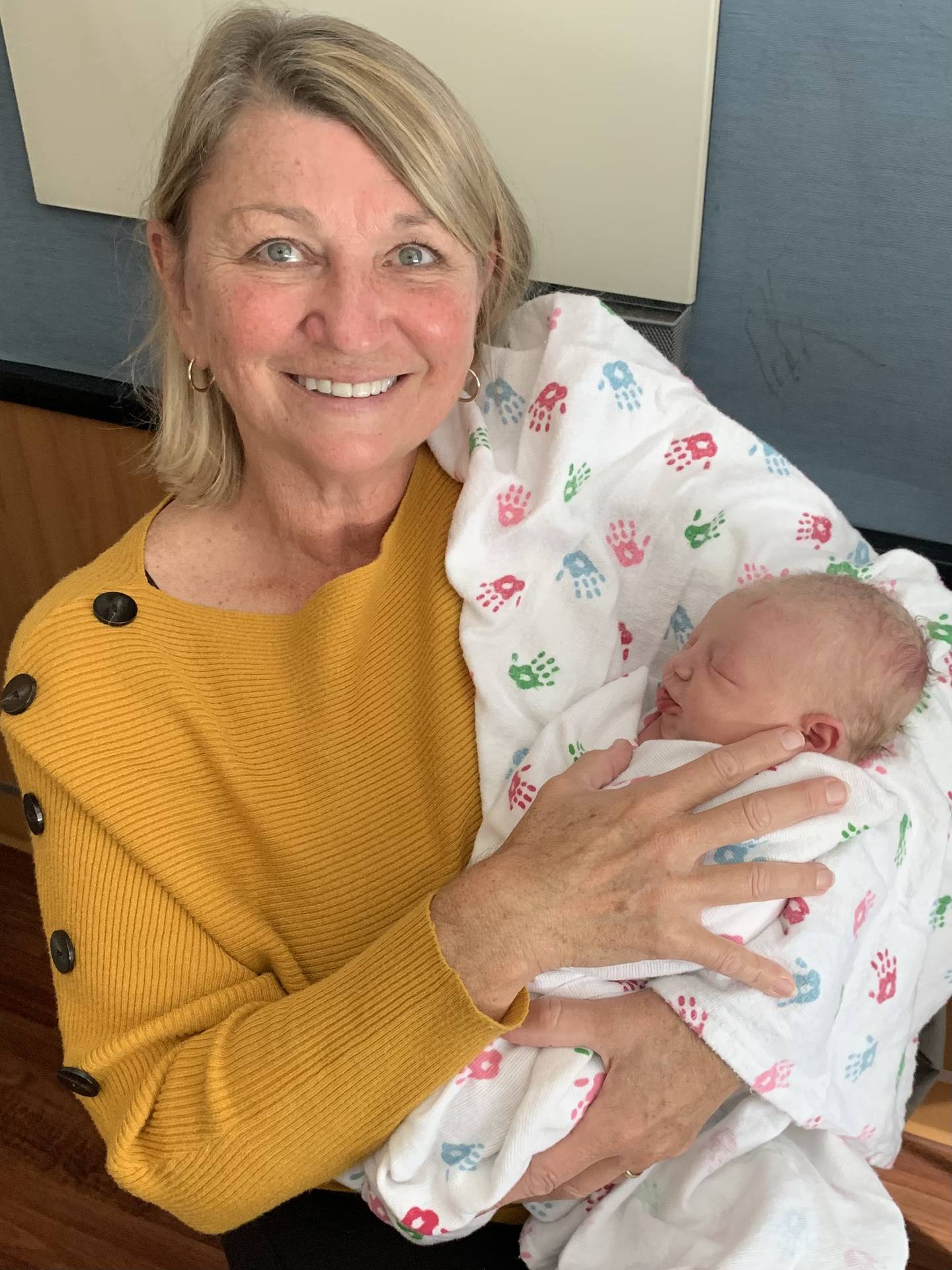 Former Sugar Grove Park District Executive Director Karen Prtichard holds her new grandchild.