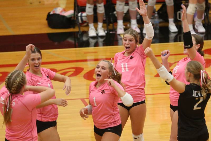 Members of the Hall volleyball team react after winning the second set against Princeton on Thursday, Oct. 9, 2025 at Hall High School.