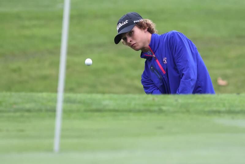 Burlington Central’s Camden Sarallo chips onto the ninth green Wednesday, Sept. 27, 2023, during the Class 2A boys golf regional at Sycamore Golf Club.