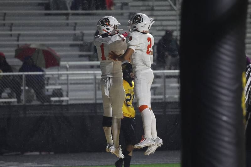 Plainfield East’s Quinn Morris (1) celebrates his touchdown catch with Jayden Cawthon (2) against Joliet West on Friday, Oct. 13, 2023 in Joliet.