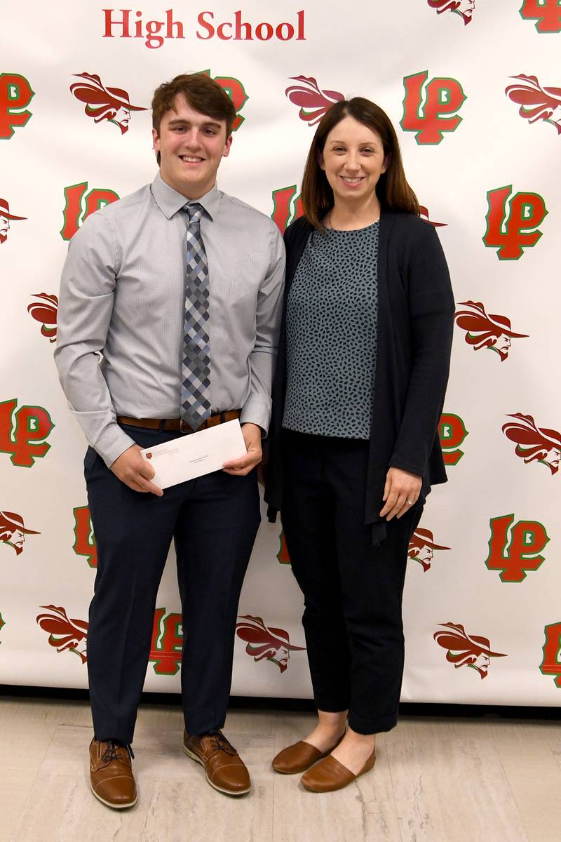 Aiden Anderson (left) received the Harry Debo Memorial Scholarship. This $1,000 scholarship, named in memory of local businessman Harry Debo, is awarded to an L-P senior who plans to pursue a degree in business, is accepted to and plans to attend a two-year or four-year college full-time and demonstrates participation in business-related activities and classes. The scholarship was presented by Jennifer Radtke (right).