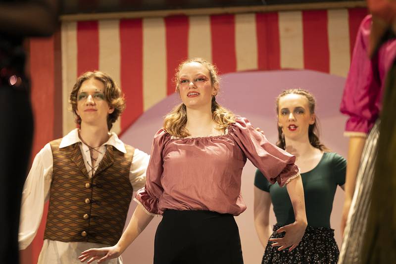 Cast members of Dixon High School’s “Pippin” rehearse the opening number Wednesday, April 17, 2024 in the Wiltz Auditorium at DHS. The show will open this Friday at 7pm.