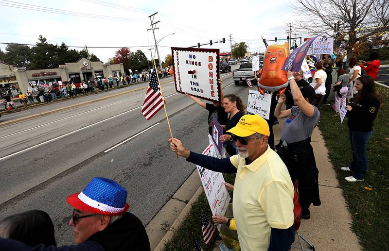 Protesters line Route 31 during a "No Kings” protest rally on Saturday, Oct. 18, 2025, in McHenry. The protest drew thousands of protesters to the area to protest the policies of President Donald Trump.