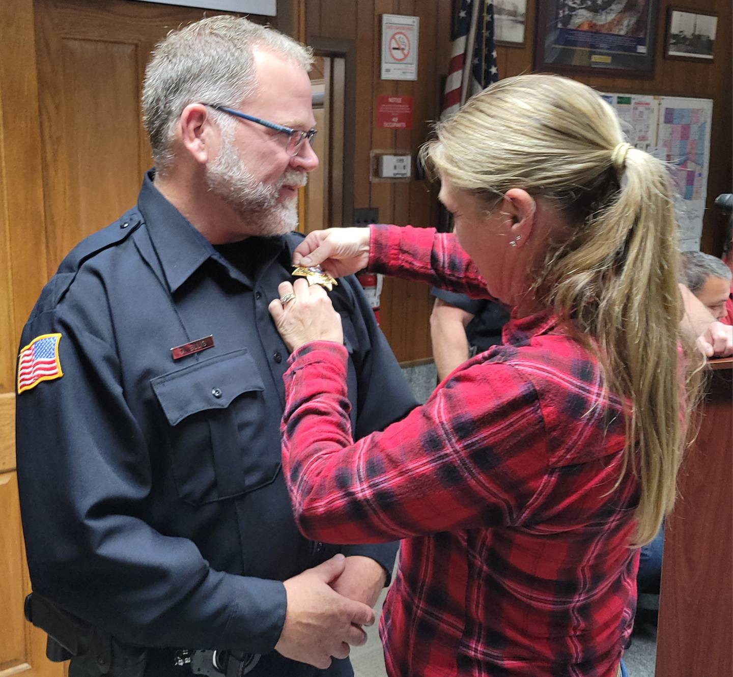 The Marseilles Police Department's Dan Ellis (left) received his sergeants badge from his wife, Vicki, at the Marseilles City Council meeting on Wednesday night.