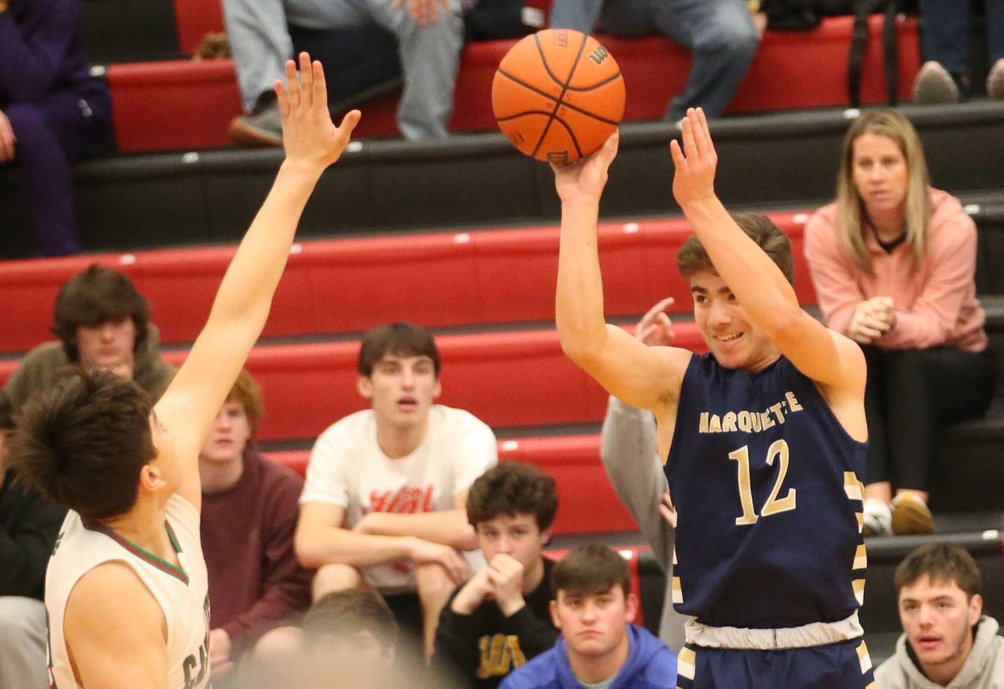 Marquette's Denver Trainor shoots a jump shot over L-P's Eric Sotelo during the 49th annual Colmone Classic Tournament on Wednesday, Dec. 6, 2023 at Hall High School.