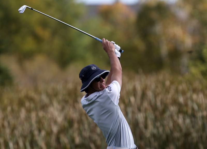 Jacobs’ Barrett Rennell watches his tee shot on the sixth hole during the IHSA Class 3A Jacobs Sectional golf tournament on Monday, Oct. 7, 2024, at Randall Oaks Golf Club in West Dundee.
