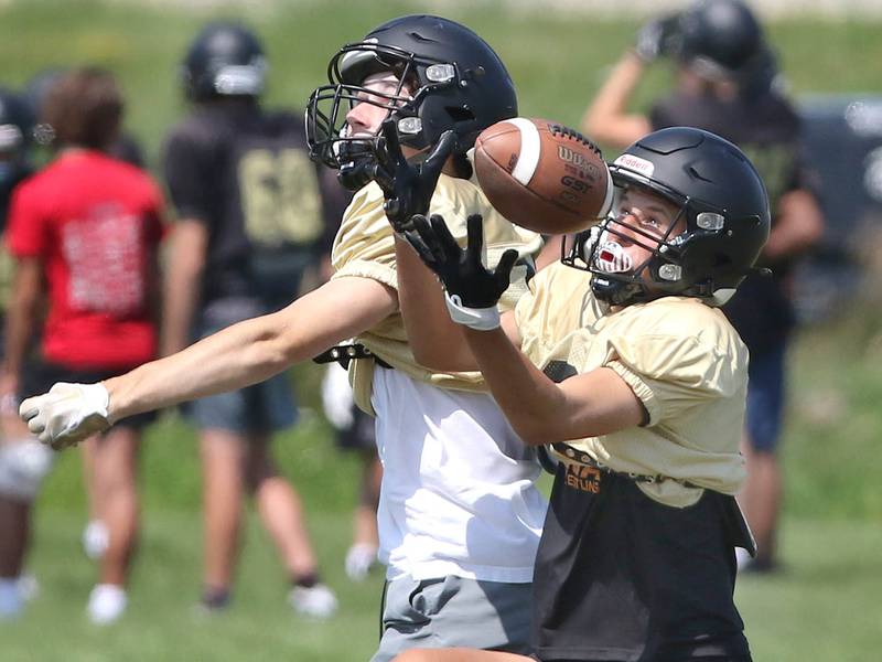 Sycamore receivers work through a drill during practice Monday, July 17, 2023 at the school.