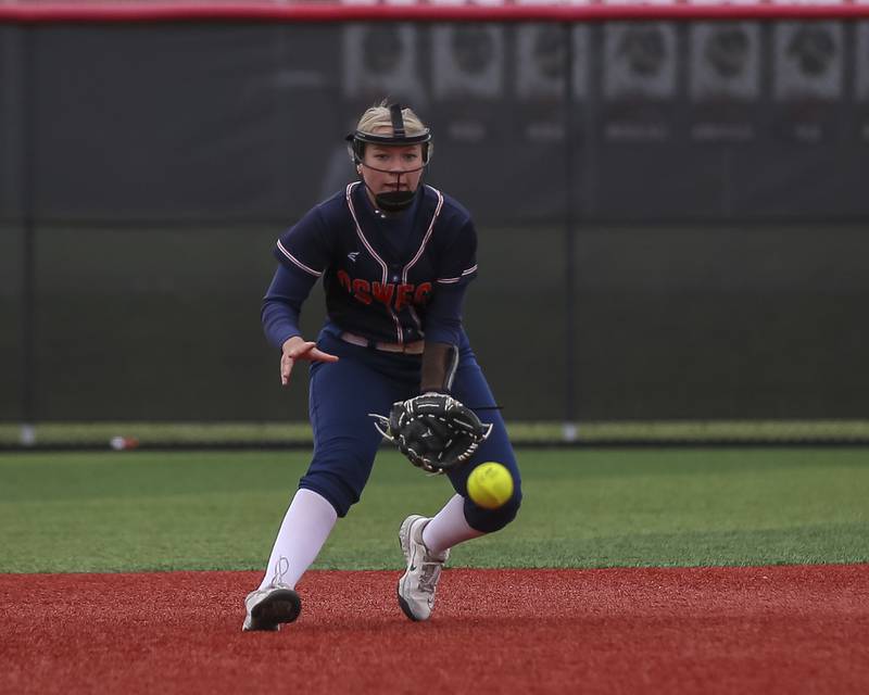 Oswego's Kennedy Gengler (9) fields a bouncer to third during softball game between Oswego at Yorkville. May 5, 2026 in Yorkville.