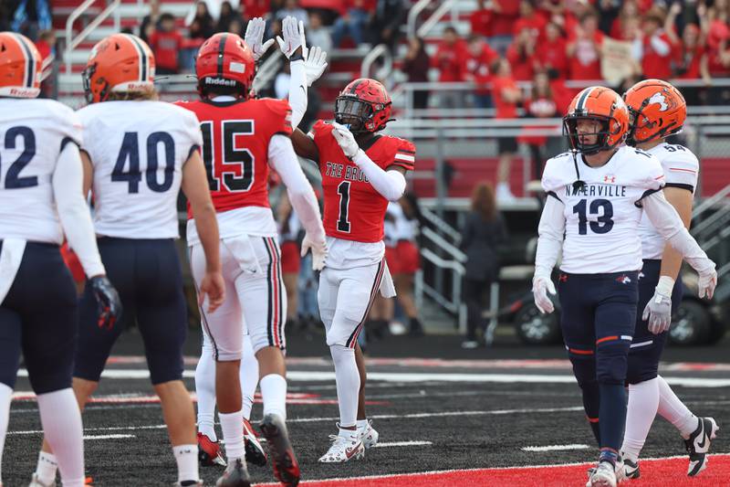 Bolingbrook’s Kyan Berry-Johnson high-fives his teammates after scoring against Naperville North on Friday, Sept. 8, 2023 in Bolingbrook.
