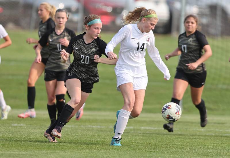 Prairie Ridge's Sarah Mayes dribbles the ball in from of Sycamore's Cortni Kruizenga during their game Wednesday, May 17, 2023, at Sycamore High School.