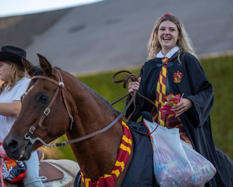 Parader atop of horse smiles to children at the annual Princeton Halloween Parade on Saturday, Oct. 4, 2025 on Main Street in Princeton.