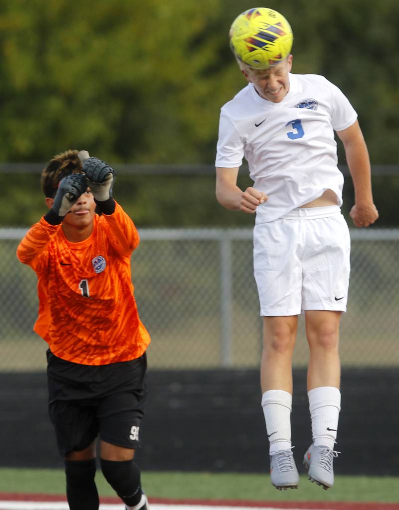 Woodstock’s Merrick Freund heads the ball away during a Richmond-Burton corner kick during a Kishwaukee River Conference soccer match on Wednesday, Sept. 10, 2025, at Richmond-Burton High School, in Richmond.