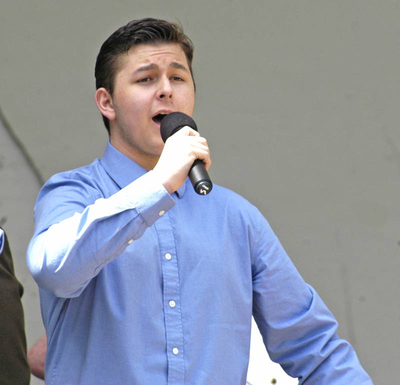 Sterling High School graduate Jameson Casey leads the crowd in the national anthem. Sterling American Post 296 hosted a commemoration at Grandon Civic Center in Sterling. The event took place Monday, May 26.