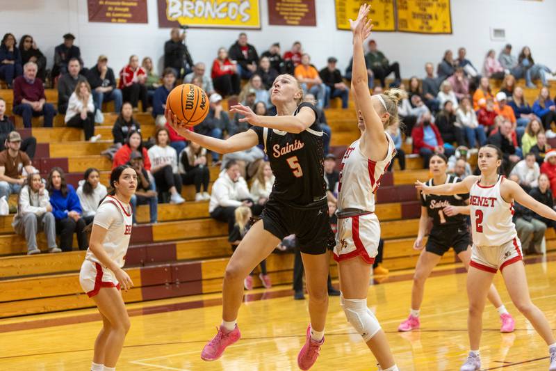 St. Charles East's Brooklyn Schilb goes in for the layup against Benet at the Montini Christmas Tournament on Tuesday, Dec.23,2025 in Lombard.
