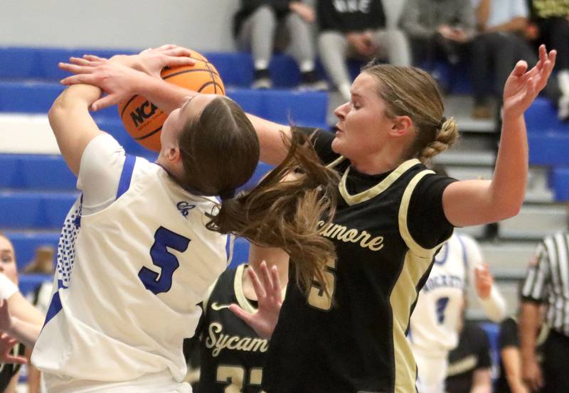 Burlington Central’s Audrey Lafleur, left, battles Sycamore’s Grace Amptmann in girls basketball at Burlington Central High School in Burlington on Tuesday, November 18, 2025.