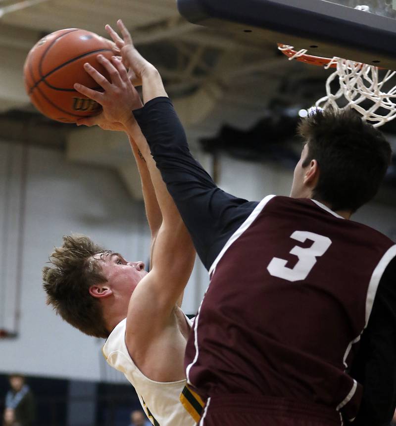 Crystal Lake South's Colton Hess drives to the basket against Wheaton Academy's Alex Moncau during the IHSA Class 3A Cary-Grove Boys Basketball Regional Championship game on Friday, Feb. 23, 2024 at Cary-Grove High School.