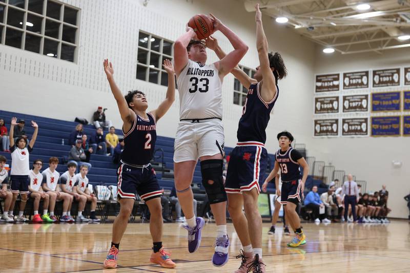 Joliet Catholic’s Anthony Birsa takes a shot from the paint against St. Viator.