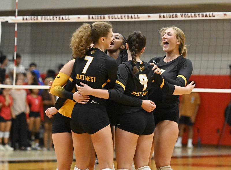 Joliet West's teammates celebrate during a non-conference game against Bolingbrook on Wednesday, Aug. 23, 2023, at Bolingbrook. (Dean Reid for Shaw Local News Network)