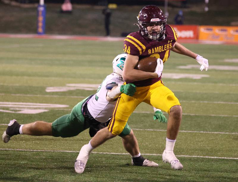 Loyola Academy's Drew MacPherson gets by York’s Evan Gaughan on his way to scoring a touchdown during their Class 8A state championship game Saturday, Nov. 30, 2024, in Hancock Stadium at Illinois State University in Normal.