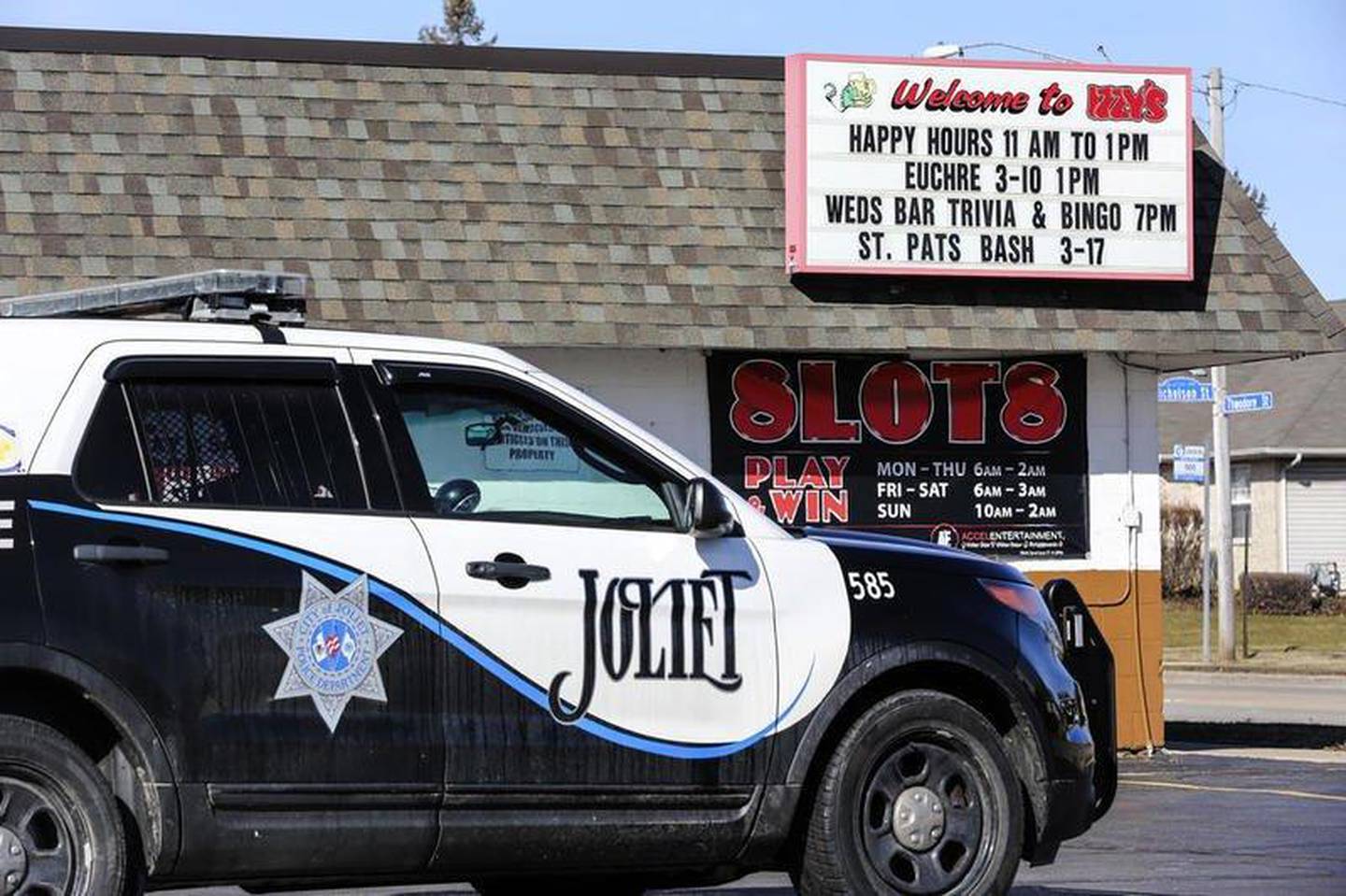 Joliet police squad car at Izzy's Bar on March 9, 2018. Patrick Gleason was arrested and charged for killing a bartender and wounding another man in a shooting incident.