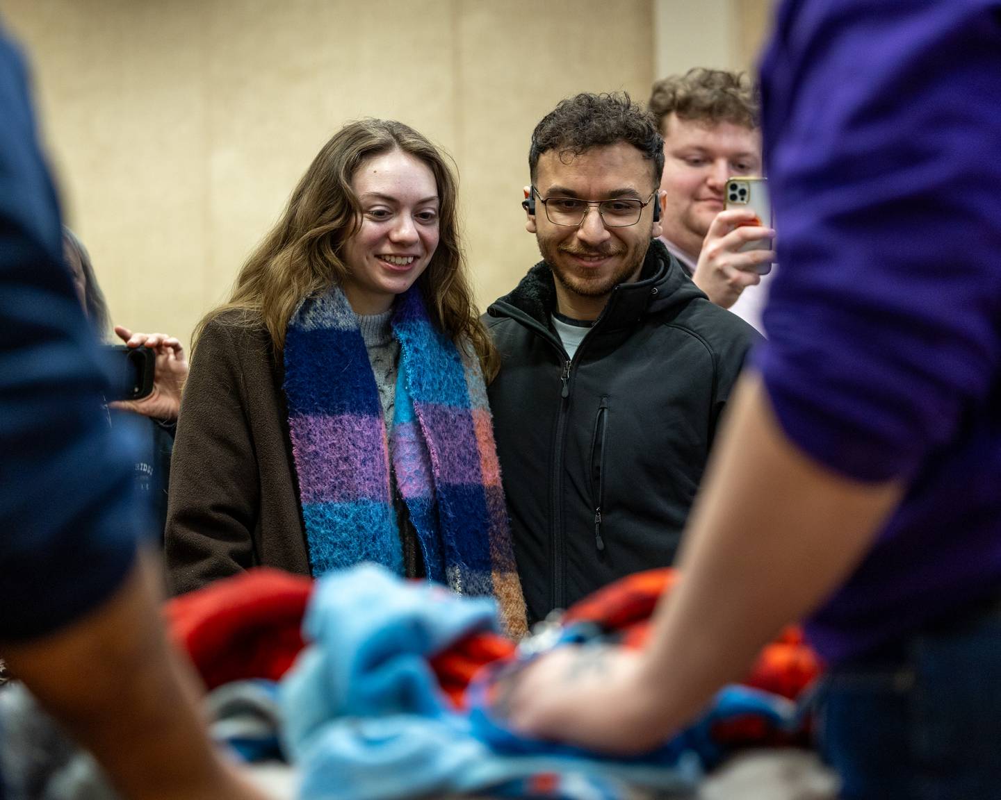 (from left) Elizabeth Wherry and Husband Isaac watch the 'Groundhog Presentation' as Wanda the Groundhog sits in bed on Sunday, Feb. 1, 2026 at Starved Rock Visitors Center in Oglesby.