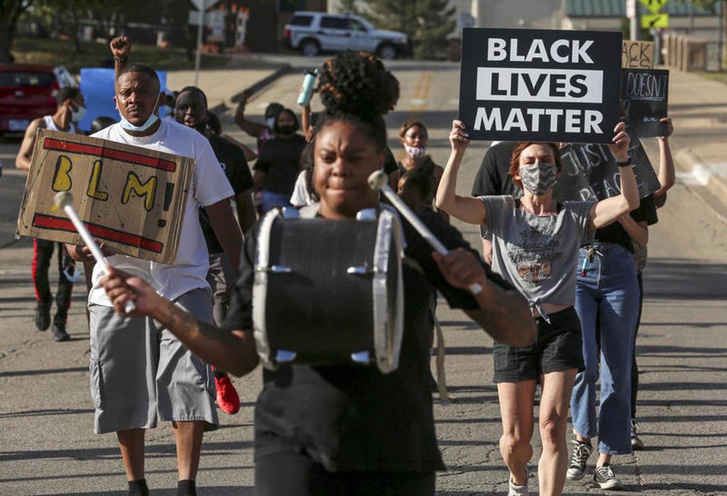 Demonstrators can be seen protesting outside Joliet City Hall, the Will County Courthouse and the Joliet Police Department on Saturday, Aug. 22, 2020, in response to the January 28 overdose death of Eric Lurry who died in police custody.