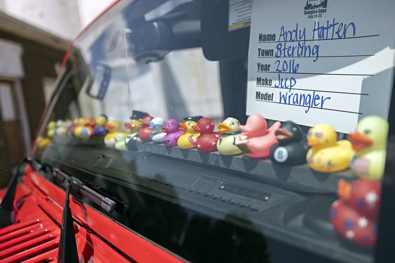 A menagerie of rubber ducks sit on the dash of a Jeep on display at the Tampico Days car show Saturday, July 22, 2023.