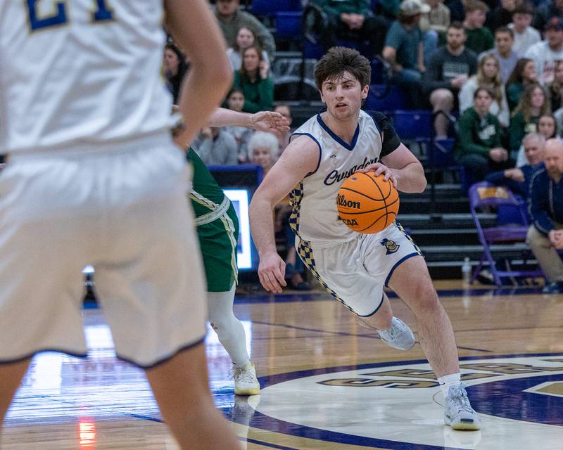 Marquette's Alec Novotney (15) dribbles ball down court during the Class 1A Regional Boys Basketball Championship game against St. Bede on Friday, Feb. 27, 2026 at Serena High School.