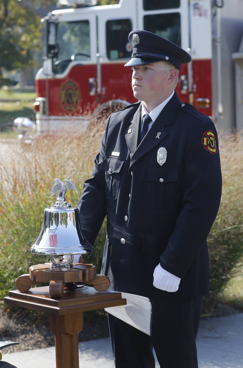 McHenry Township Fire Protection District firefighter Ryan Moore rings the fire bell during a September 11 Remembrance Ceremony on Sept. 11, 2025, at Veterans Park in McHenry.